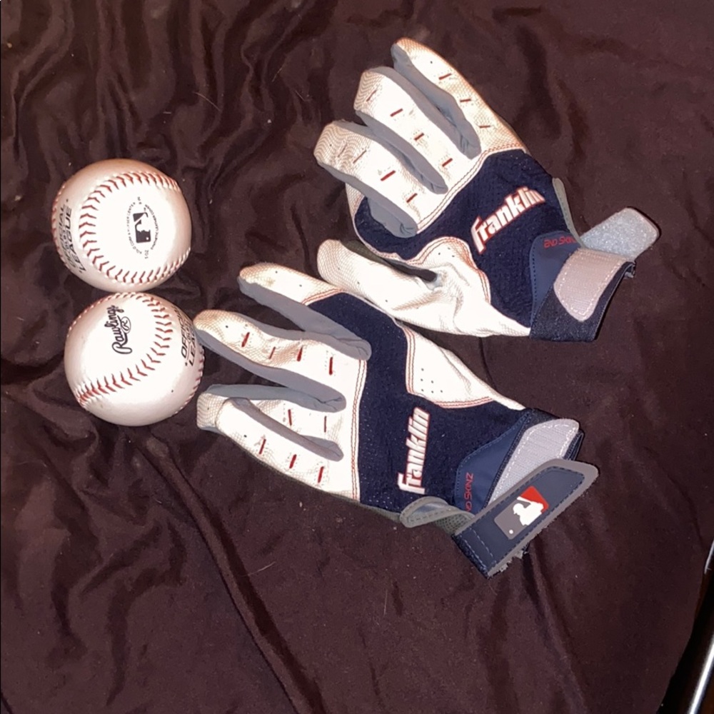 2 baseballs. One pair of baseball gloves